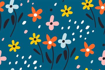 Ditsy floral background.Cute pattern in small flower. Small colorful flowers. Seamless repeat pattern with flowers and leaves on a blue background.