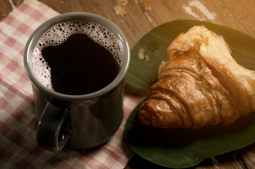cup of coffee and croissant