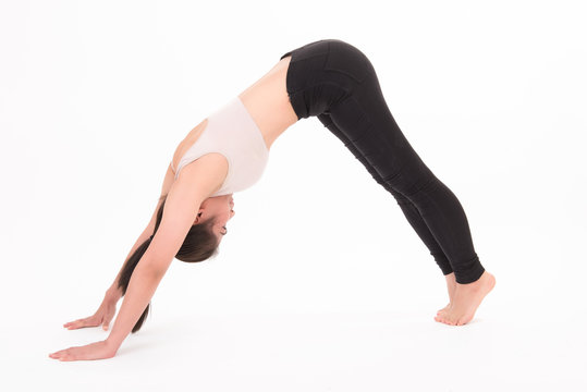 Portrait of woman stretching isolated on white background. Image of a girl practicing yoga on white. Health care sport girl concept.