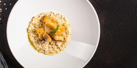 risotto fish (main course rice with seafood) menu concept. food background. copy space. Top view