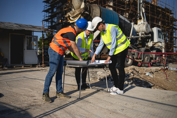 Three construction workers having meeting,stock photo