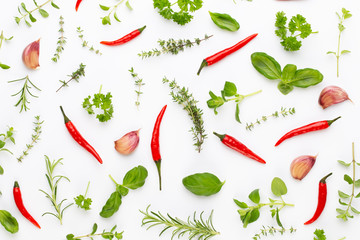 Fototapeta premium Spice herbal leaves and chili pepper on white background. Vegetables pattern. Floral and vegetables on white background. Top view, flat lay.