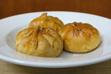 Fill your stomach with a plate of delicious savory Asian snack food made with baked bun stuffed with diced meat (pork, chicken). Locally known in Malaysia as Siew Pao (Siu Bao).