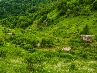 Fototapeta na wymiar Old abandoned farm structures in the mountains of Armenia