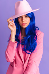 Image of nice seductive woman in navy blue wig looking at camera