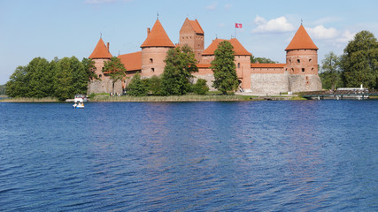 Fototapeta na wymiar The famous Trakai Island Castle in Lithuania in a blue sky day and calm lake