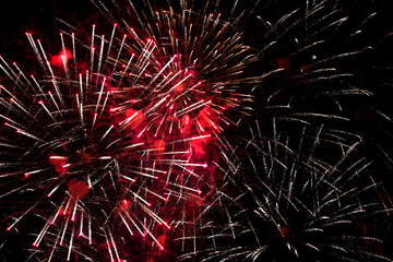 Colorful fireworks in the sky at night as background