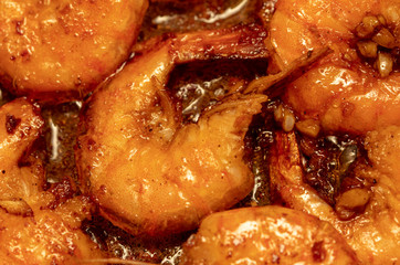 Shrimp fried in a pan in oil