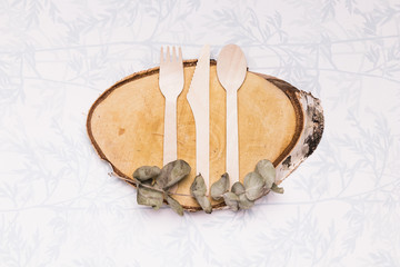 Wooden tableware on wooden board