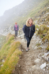 Backpacker ladies hiking on a trail