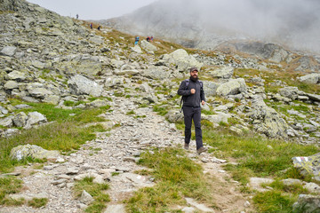 Naklejka premium Man with backpack hiking