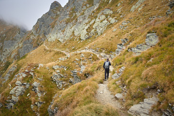 Naklejka premium Man with backpack hiking