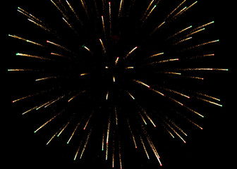 Fireworks sparkles in the night sky as background