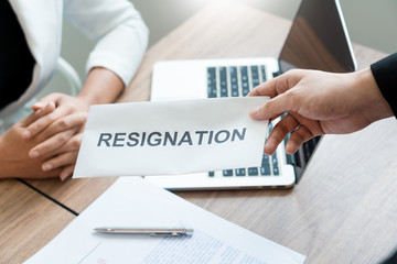 Businessman sending resignation letter to employer boss Including about resignation from positions and vacancies, changing and resigning from work concept for quit or change of job leaving the office
