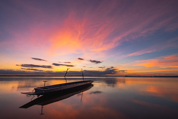 Boat in water during sunset