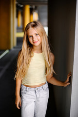 Portrait of a beautiful girl with long blond hair