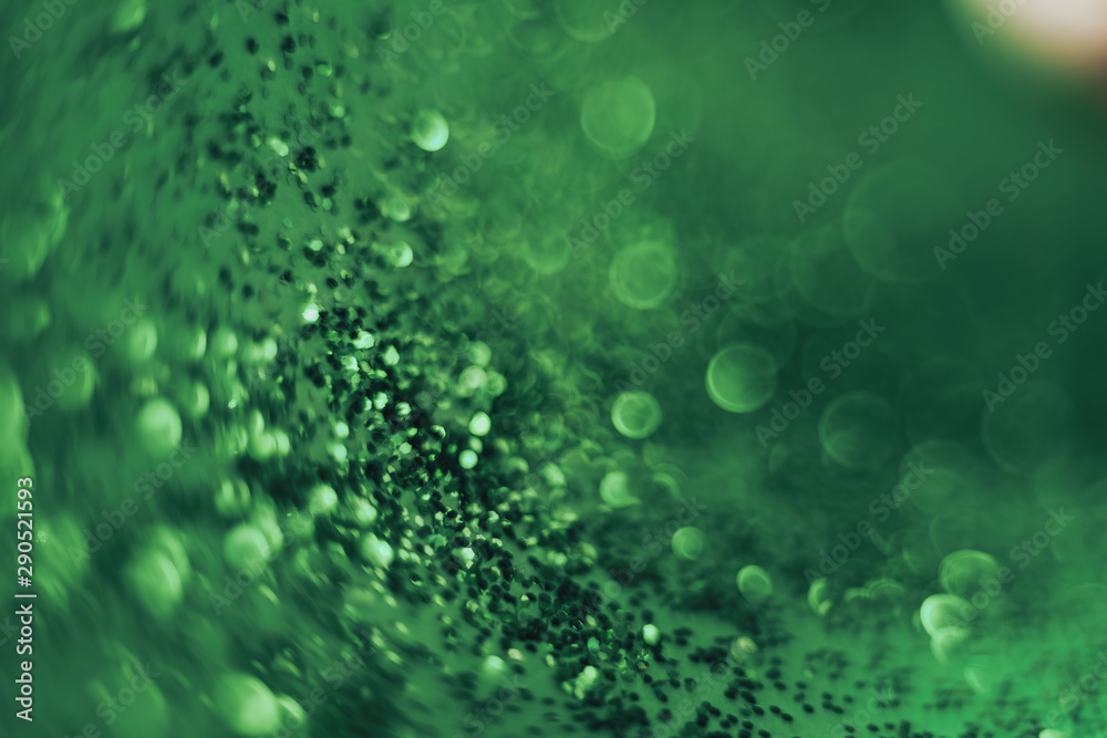 Aufkleber beautiful abstact light bokeh on a green background.