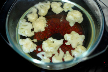 Quickly prepare the cauliflower. Dietary, proper, baby food concept.