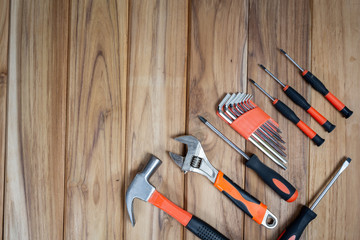 Manual tool set, set on wooden floor.