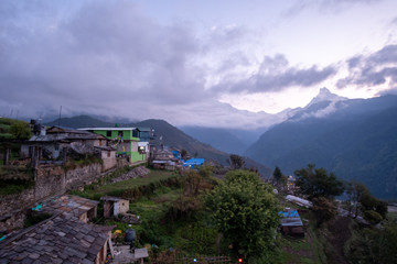 Fototapeta na wymiar Houses in mountain village and field, Annaourna region, Nepal. Outdoor, alternative.