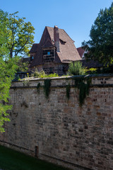Nuremberg city wall with mayor's tower and mayor's garden and moat, in the background the old town