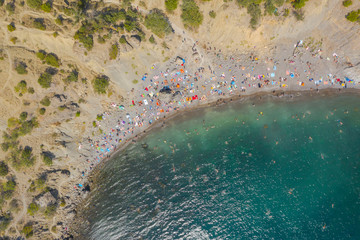 Aerial view of crowded colorful paradise beach on Black Sea, Crimea