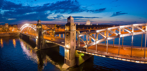 Bridges of St. Petersburg in Illumination. Russia. Peter the Great Bridge in St. Petersburg. Bolsheokhtinsky bridge at night. Night St. Petersburg. Cities of Russia. Vacations in Russia. Drawbridge