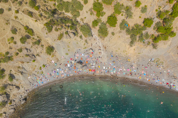 Aerial view of crowded colorful paradise beach on Black Sea, Crimea