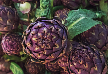 Fresh purple artichokes on farmers market