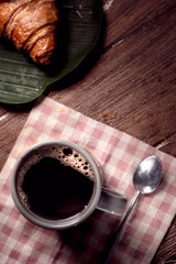 cup of coffee and croissant