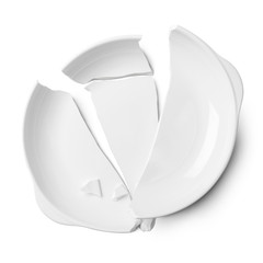 Broken white ceramic plate on a white floor with clipping path.