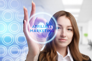 The concept of business, technology, the Internet and the network. A young entrepreneur working on a virtual screen of the future and sees the inscription: Affiliate marketing