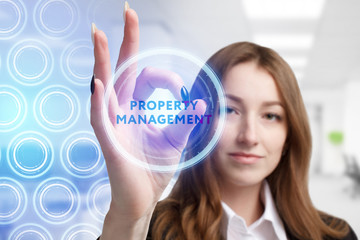 The concept of business, technology, the Internet and the network. A young entrepreneur working on a virtual screen of the future and sees the inscription: Property management