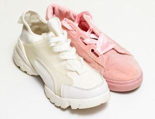 White and pink sports shoes for girls, fashion.