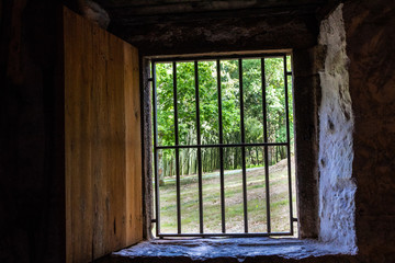 old windows in a rural house with bars