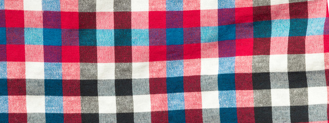 Background of colored fabric with a large cage pattern