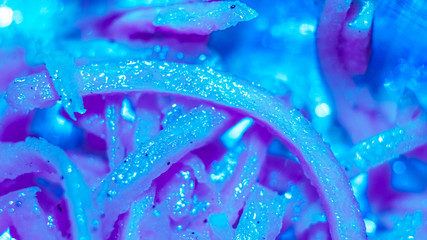 fresh tasty grated carrot background painted to blue