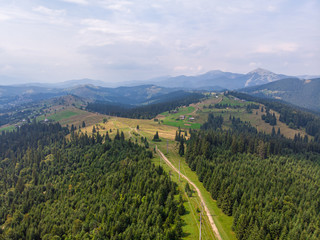 Fototapeta na wymiar Inspirational aerial view on road in mountains Beautiful scene from above.