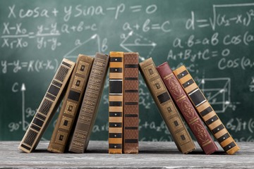 Books stack collection in a pile on wooden table