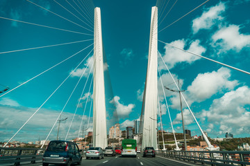 Tall white curtain car bridge with road