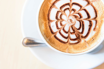 hot coffee on table / hot cappuccino with nice pattern milk foam 