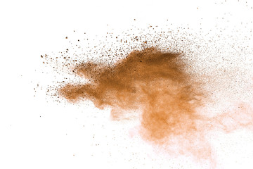 Fototapeta na wymiar Explosion of brown powder on white background. 