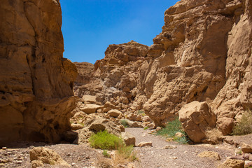 Middle East Jordan desert canyon rocky scenery landscape wilderness environment with passage between mountains 
