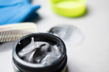 Black hair wax in tubs for men