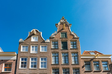 Fototapeta na wymiar gable houses in street Haarlemmerstraat in Amsterdam, The Netherlands