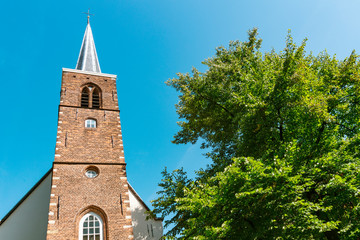 Fototapeta na wymiar Tower of Begijnhof Chapel in Amsterdam, The Netherlands