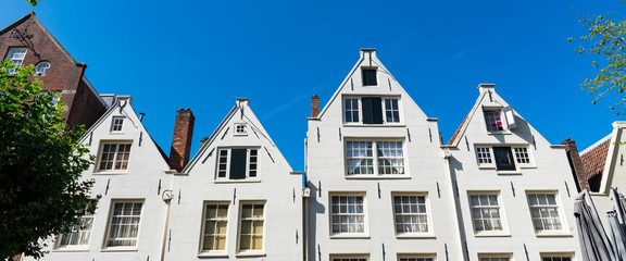 White houses in street Spui in Amsterdam, The Netherlands