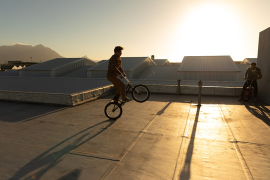 BMX riders on a rooftop