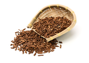 Dried medicinal herbs raw materials isolated on white. Root of Taraxacum