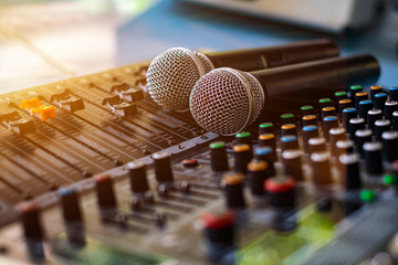 Microphone and audio sound mixer analog at the sound control room